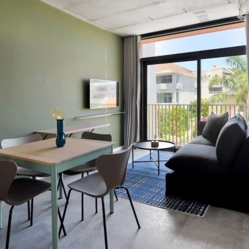 Open plan dining area, lounge and sliding doors onto Juliette balcony