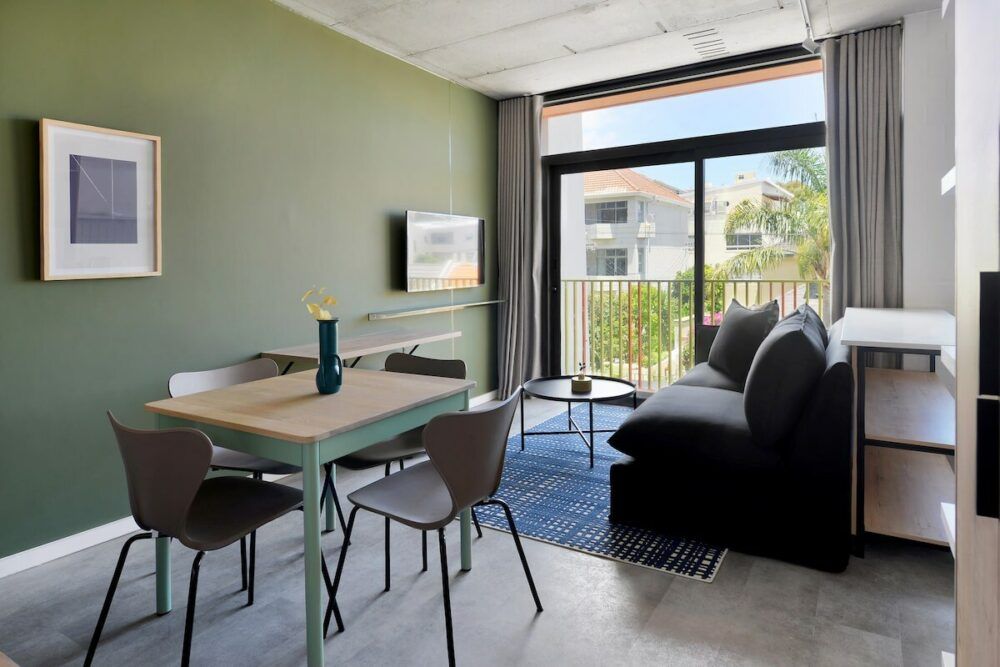 Open plan dining area, lounge and sliding doors onto Juliette balcony